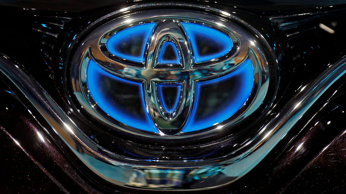 The Toyota logo is seen on the bonnet of a newly launched Camry Hybrid electric vehicle at a hotel in New Delhi. Photo: Reuters