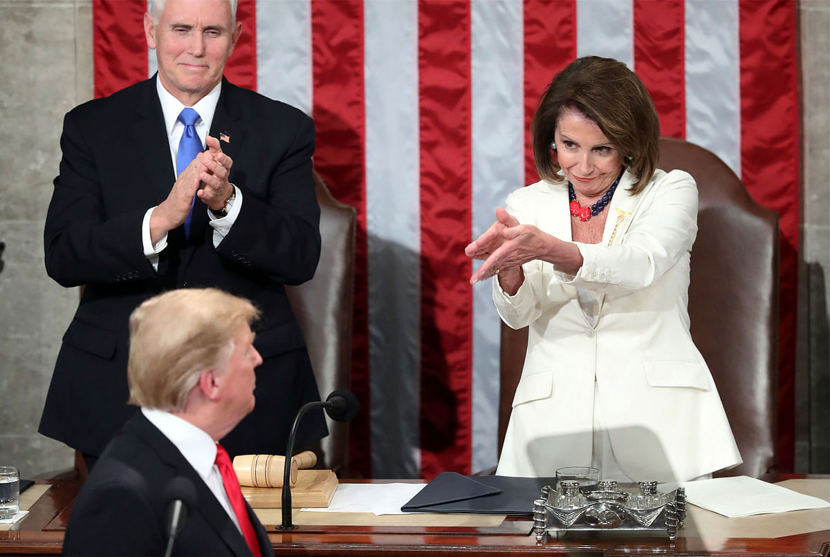 President Donald Trump turns to House speaker Nancy Pelosi of Calif., as he delivers his State of the Union address to a joint session of Congress on Capitol Hill in Washington, as vice president Mike Pence watches, Tuesday, 5 February 2019. Photo: AP