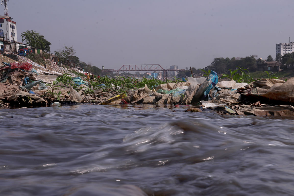 Polluted water flowing in the river.