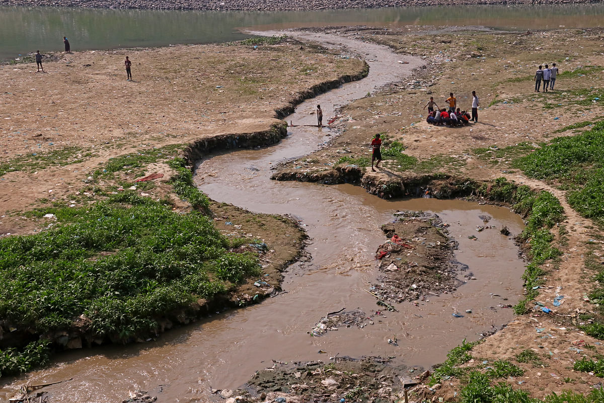 Polluted water flowing through canal to Surma river in Sylhet city.