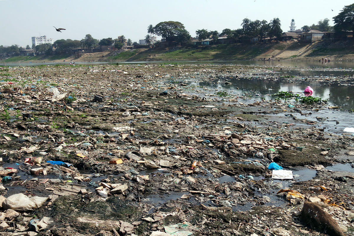 Garbage-filled Surma river is photographed in Sylhet city.