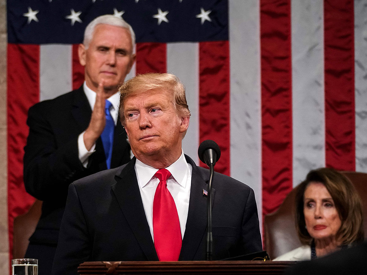 In this file photo taken on 5 February US president Donald Trump delivers the State of the Union address, alongside vice president Mike Pence and speaker of the house Nancy Pelosi, at the US Capitol in Washington, DC. Photo: AFP