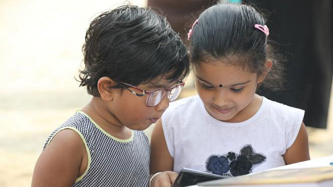 Children browse books at Ekushey book fair in Dhaka on 8 February. Photo: Abdus Salam