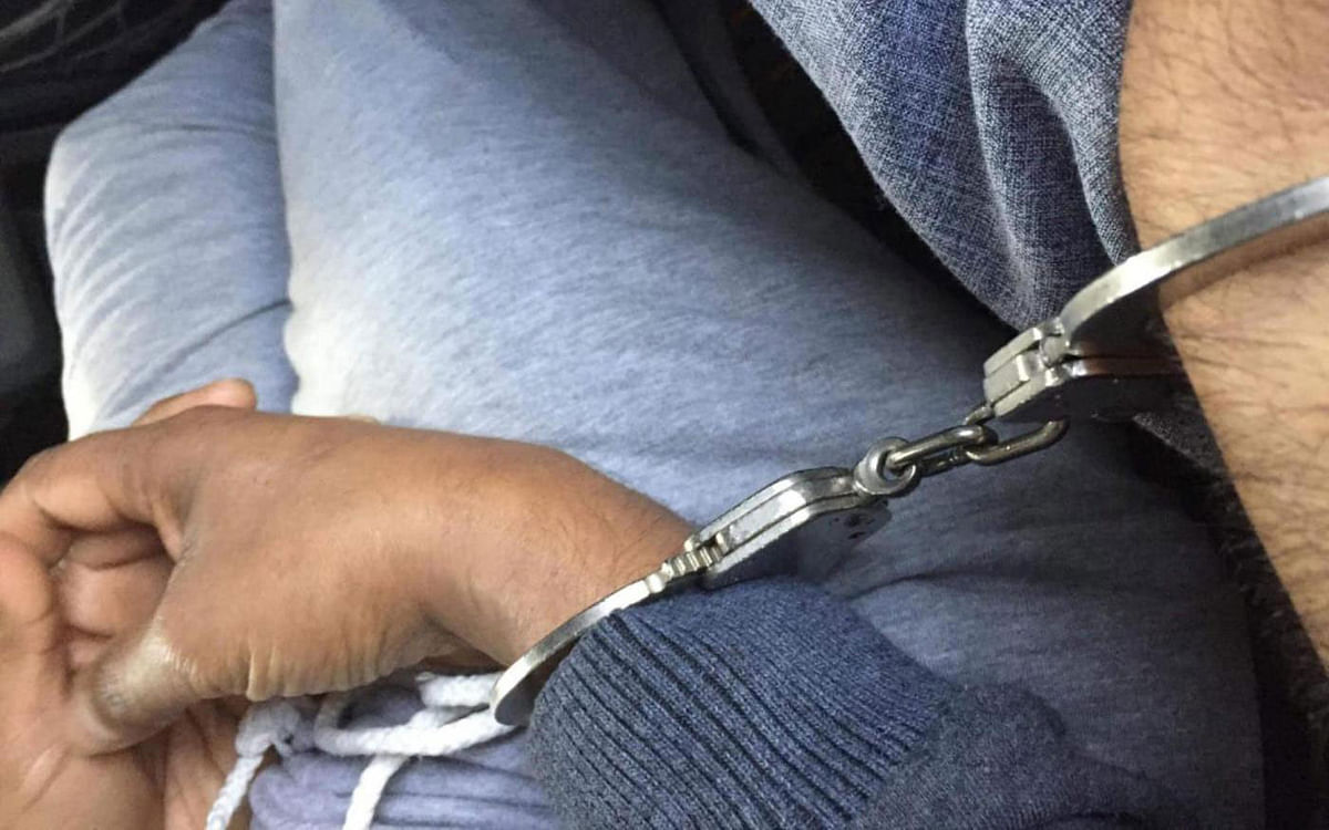 Rohingya detainees handcuffed by Saudi immigration police ahead of their deportation to Bangladesh—Photo: MEE/Supplied