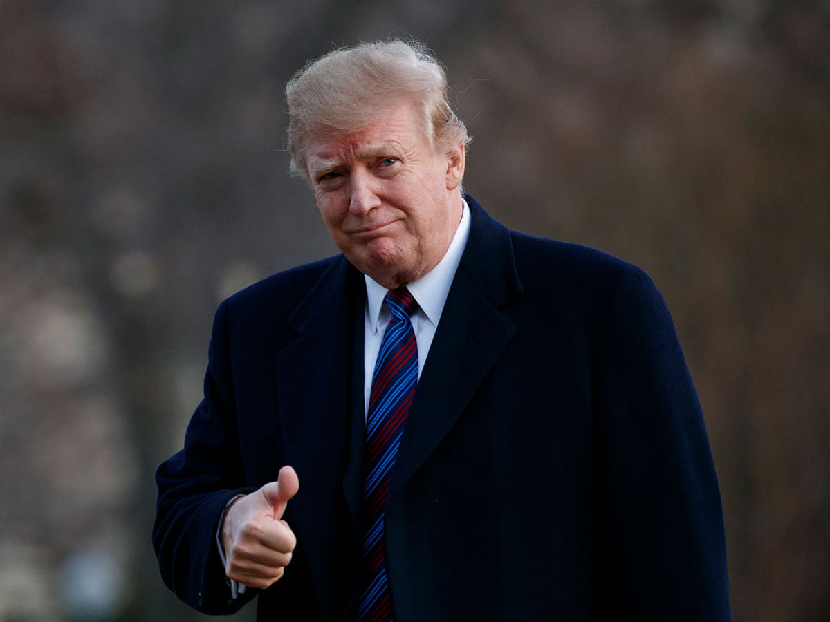 President Donald Trump gives a thumbs-up after arriving on Marine One on the South Lawn of the White House in Washington on 8 February. Photo: AP