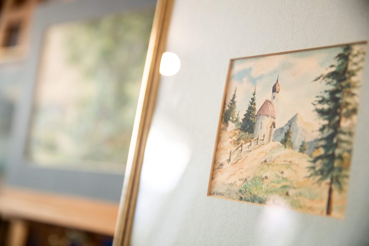 A picture taken on 8 February shows the watercolour entitled `Bergkapelle mit Fichten` (Mountain chapel with spruces), signed `A. Hitler`, which is on display at the Weidler auction house in Nuremberg in the southern city of Nuremberg. Photo: AFP
