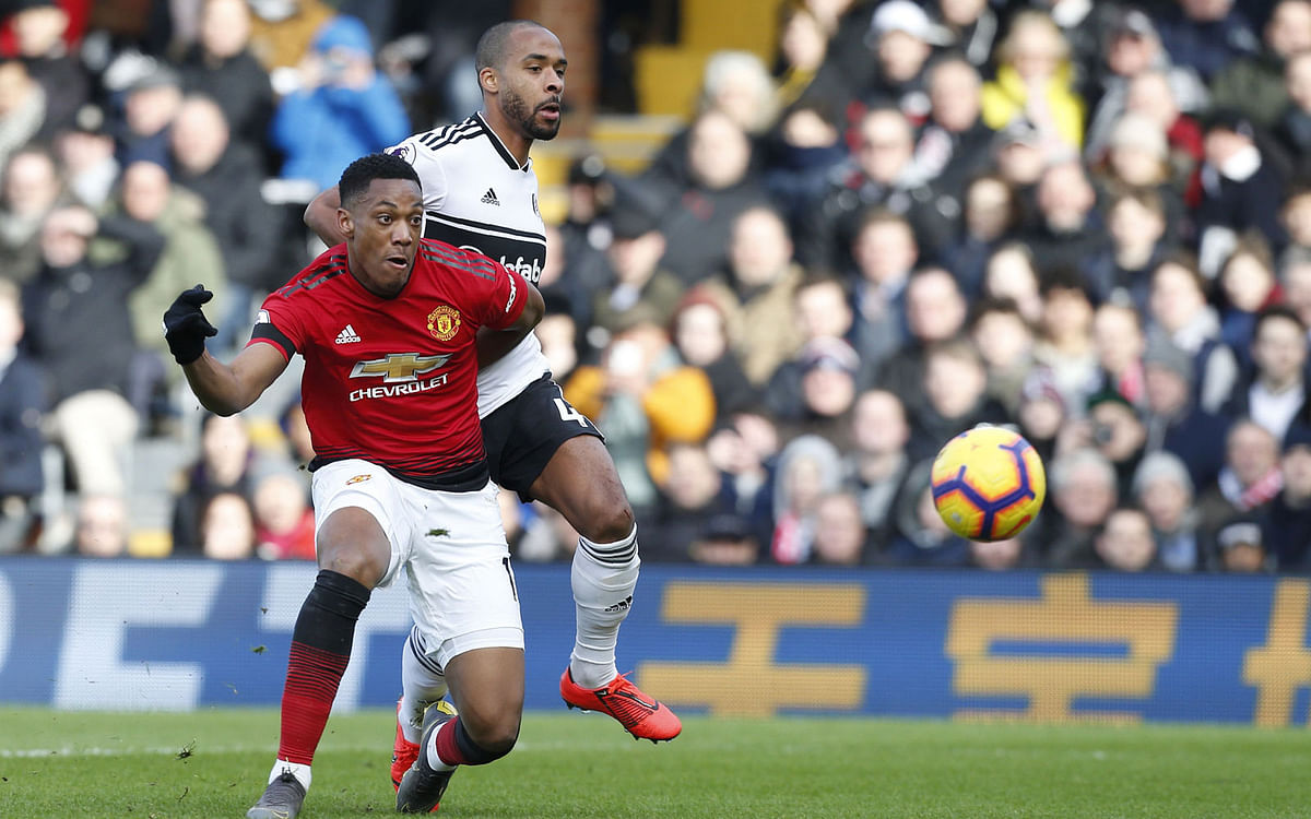 Manchester United’s French striker Anthony Martial (L) shoots to score their second goal during the English Premier League football match on 9 February 2019. Photo: AFP.