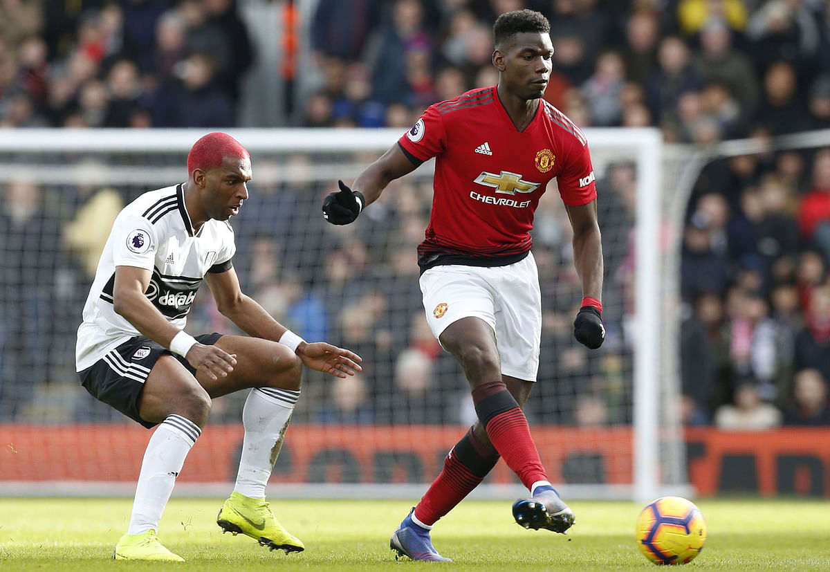 Manchester United’s French midfielder Paul Pogba ® vies with Fulham’s Dutch defender Ryan Babel (L) during the English Premier League football match between Fulham and Manchester United at Craven Cottage in London on 9 February, 2019. Photo: AFP.