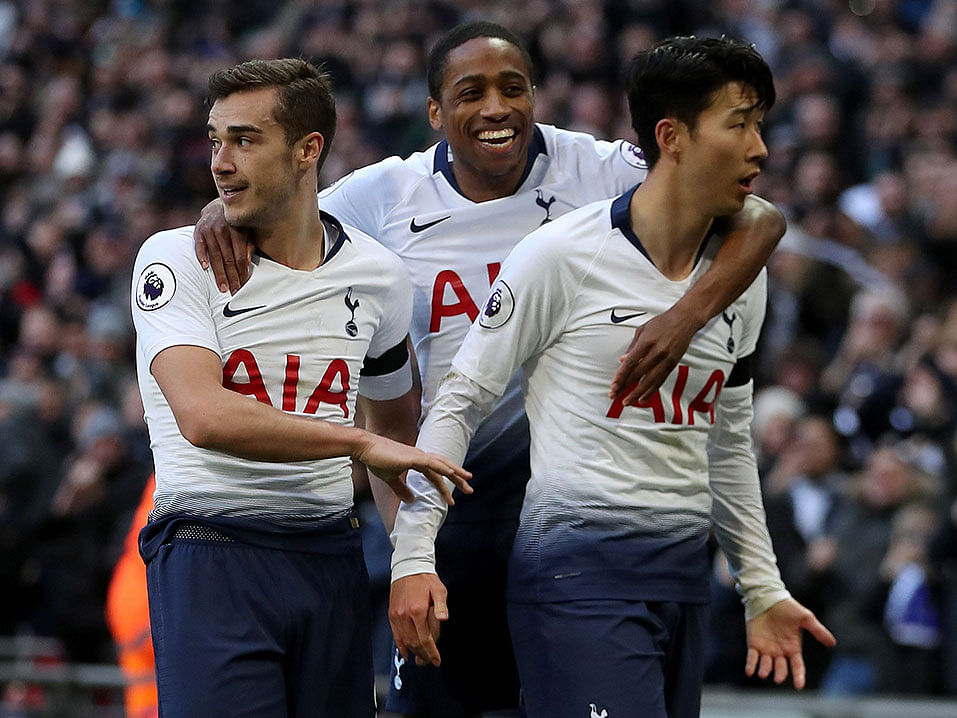 Tottenham Hotspur`s South Korean striker Son Heung-Min celebrates with Tottenham Hotspur`s English midfielder Harry Winks after scoring his team`s third goal during the English Premier League football match between Tottenham Hotspur and Leicester City at Wembley Stadium in London, on 10 February, 2019. Photo: AFP