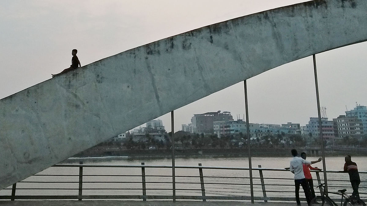 A child on the railing of a bridge over the lake of Hatirjheel, Dhaka on 9 February. Visitors often climb the railing taking risks to take pictures. Photo: Nusrat Nowrin