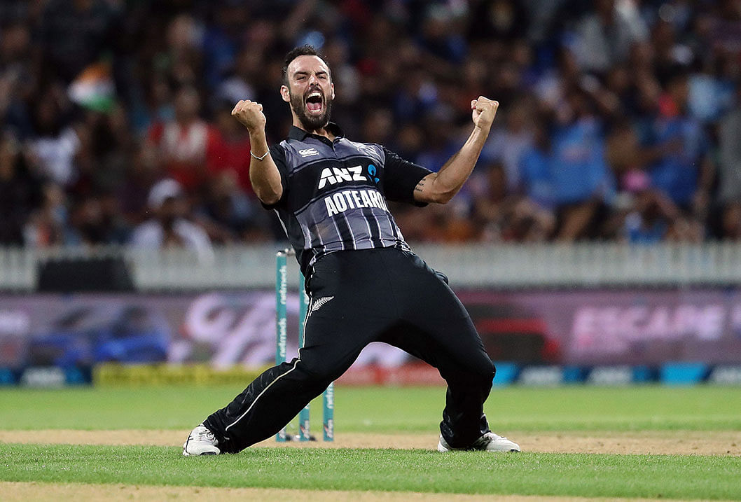 New Zealand`s Daryl Mitchell celebrates the wicket of India`s MS Dhoni during the third Twenty20 international cricket match between New Zealand and India in Hamilton on 10 February, 2019. Photo: AFP