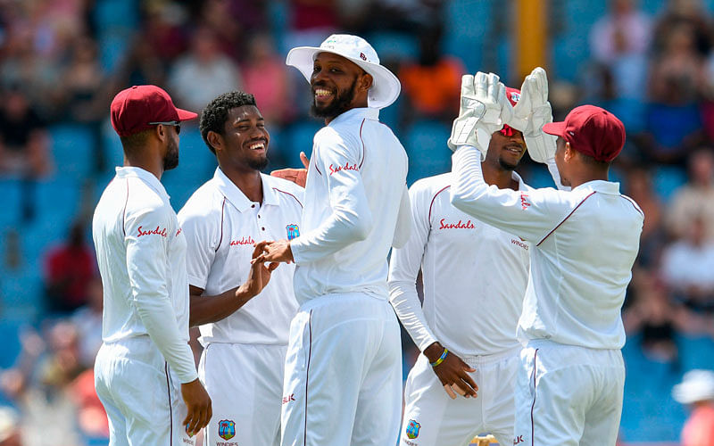 Keemo Paul (2L) and Roston Chase © of West Indies celebrate the dismissal of Keaton Jennings of England during day 1 of the 3rd and final Test between West Indies and England at Darren Sammy Cricket Ground, Gros Islet, Saint Lucia, on 9 February 2019. Photo: AFP