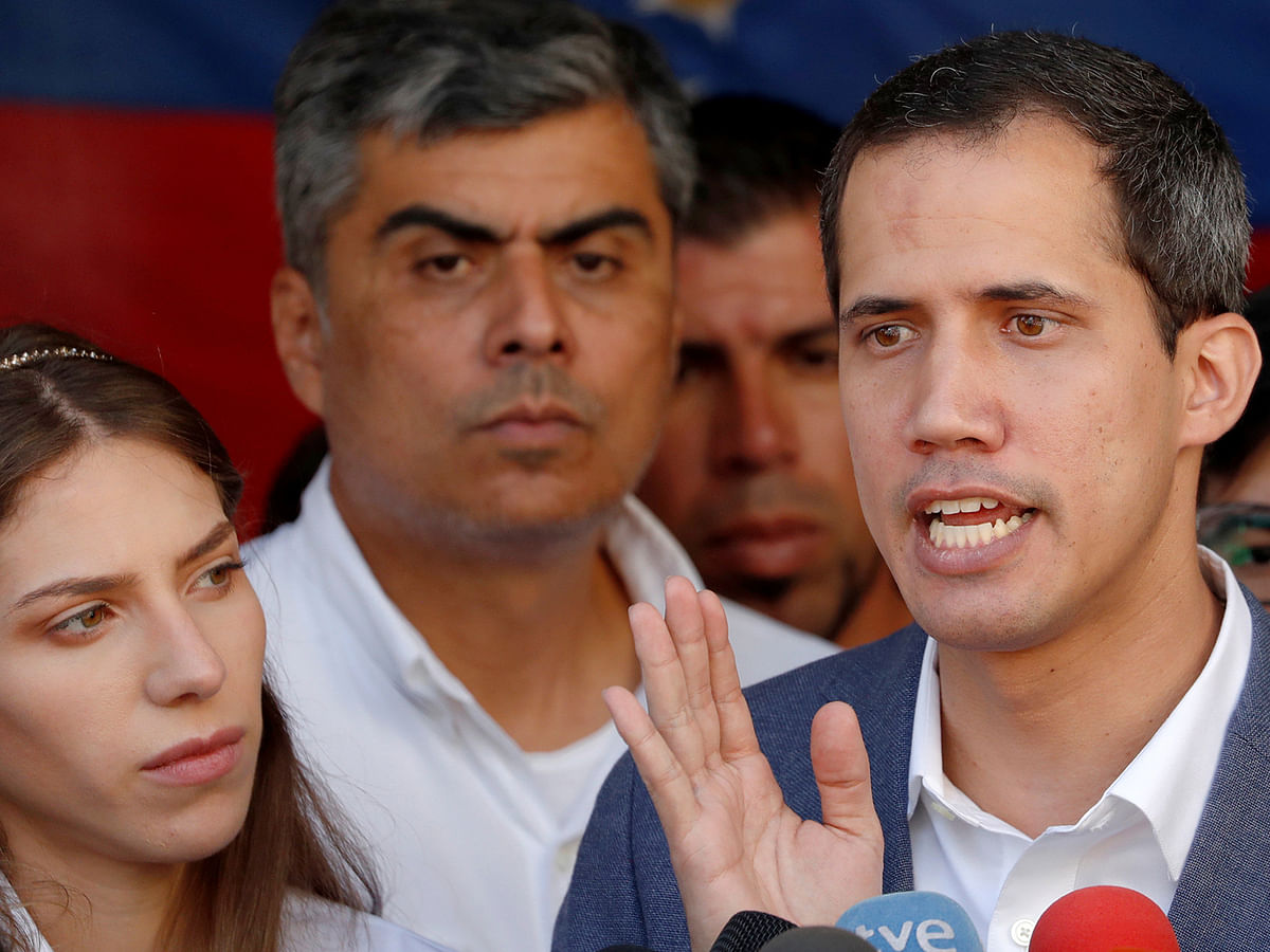 Venezuelan opposition leader Juan Guaido, who many nations have recognized as the country`s rightful interim ruler, talks to the media after attending a religious event in Caracas, Venezuela 10 February. Photo: Reuters