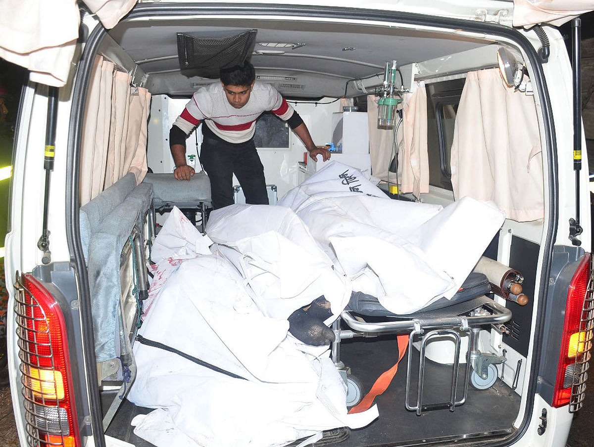 Bodies of five young men being carried in an ambulance on Sunday. Photo: Focus Bangla