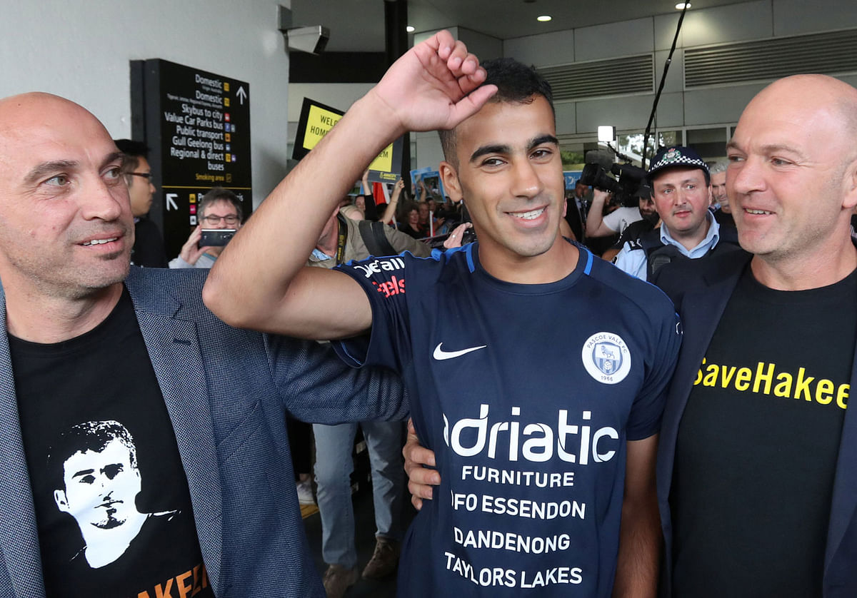 Supporters greet refugee footballer Hakeem Al-Araibi (centre) as he arrives at Melbourne International Airport in Melbourne, Australia, 12 February 2019. Photo: Reuters