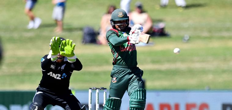 Bangladesh`s Mohammad Mithun plays a shot as New Zealand`s wicketkeeper Tom Latham (L) looks on during the first one-day international (ODI) cricket match between New Zealand and Bangladesh in Napier on 13 February 2019. 