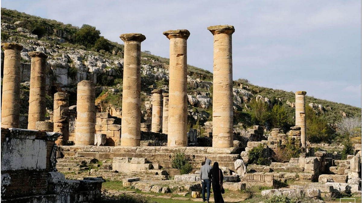 People stand next to the ancient ruins of the Greek and Roman city of Cyrene, in Shahhat, Libya, on 9 February 2019.  Photo: Reuters