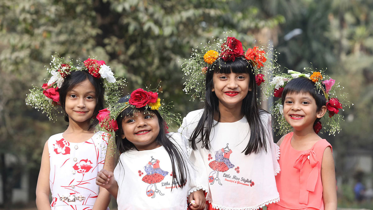 Children adorned with garlands marking the arrival of Falgun at Ramna Park in Dhaka, 12 February. Photo: Abdus Salam