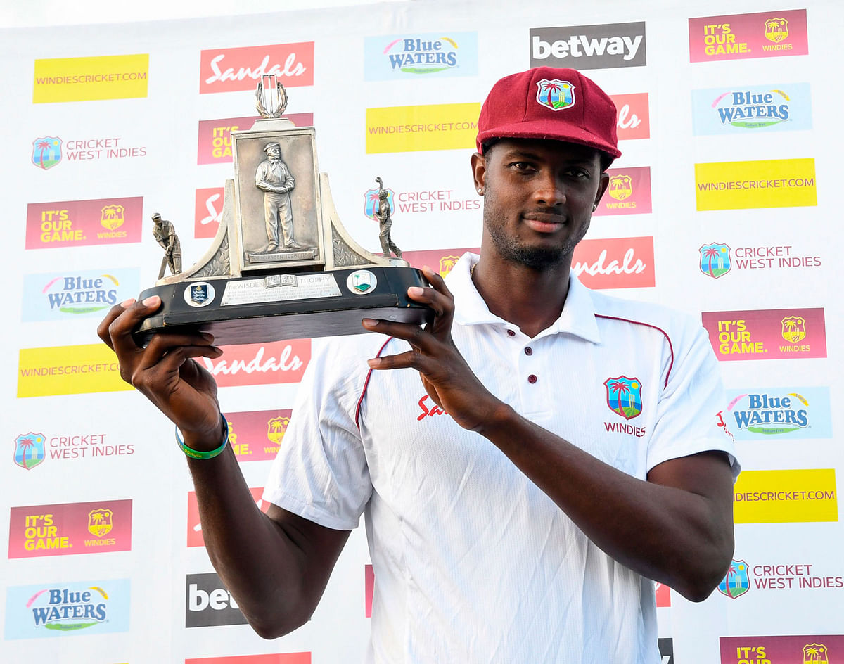 Jason Holder of West Indies holds the Wisden trophy at the end of day 4 of the 3rd and final Test between West Indies and England at Darren Sammy Cricket Ground, Gros Islet, Saint Lucia, on 12 February 2019. Photo: AFP