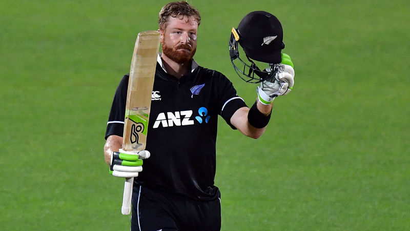 New Zealand`s Martin Guptill celebrates reaching his century (100 runs) during the first one-day international (ODI) cricket match between New Zealand and Bangladesh in Napier on 13 February 2019. Photo: AFP