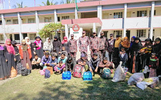 Rescued Rohingya refugees pose for photographs at the Border Guard Bangladesh camp in Teknaf on 8 February 2019. Bangladeshi border guards have rescued 30 Rohingya refugees from a coastal town who were waiting to board on boats which would “take them to Malaysia”, an official said on 8 February. Photo: AFP