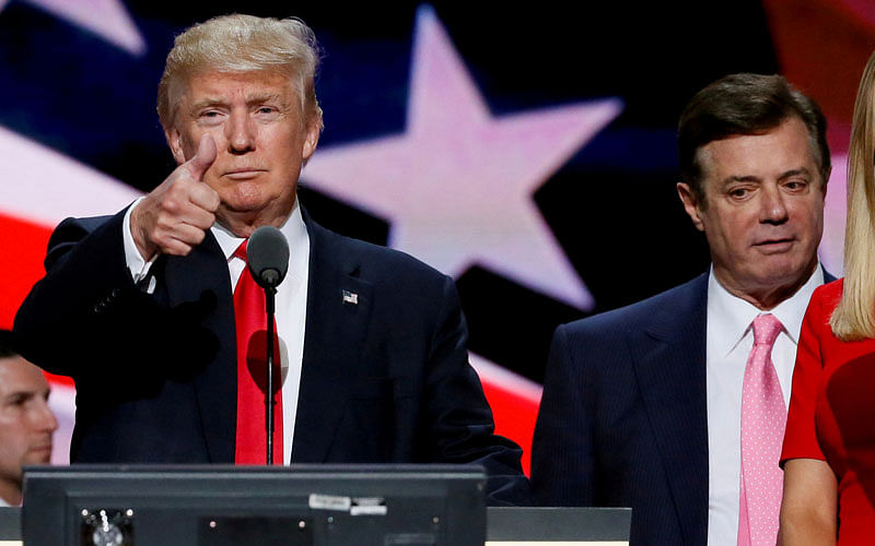 Then-Republican presidential nominee Donald Trump gives a thumbs up as his campaign manager Paul Manafort looks on during Trump’s walk through at the Republican National Convention in Cleveland, US, 21 July 2016. Photo: Reuters