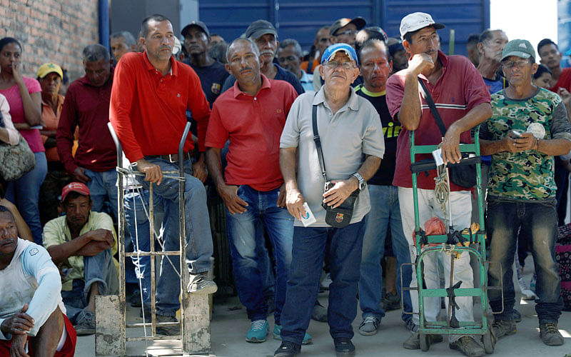 Venezuelans line up as they wait for a free lunch at the “Divina Providencia” migrant shelter outskirts of Cucuta, on the Colombian-Venezuelan border, Colombia on 13 February 2019. Photo: Reuters