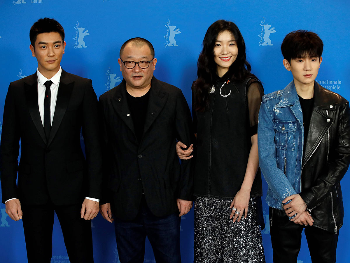 Chinese actor Du Jiang, Chinese director, screenwriter and producer Wang Xiaoshuai (L), Chinese actress Qi Xi and Chinese actor and singer Wang Yuan pose during a photocall for the film `So long my son` (Di jiu tian chang) presented in competition at the 69th Berlinale film festival on 14 February, 2019 in Berlin. Photo: AFP
