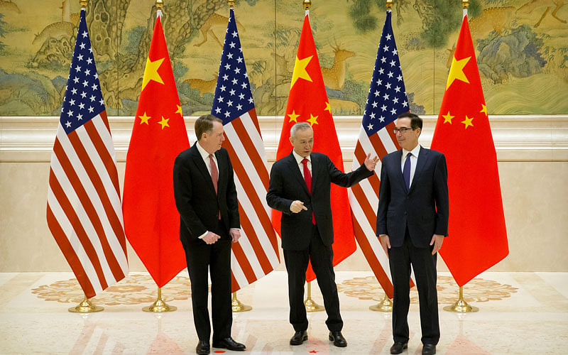 From left, US Trade Representative Robert Lighthizer, Chinese vice premier and lead trade negotiator Liu He, and US treasury secretary Steven Mnuchin talk before the opening session of trade negotiations at the Diaoyutai State Guesthouse in Beijing, Thursday, on 14 February 2019. Photo: Reuters