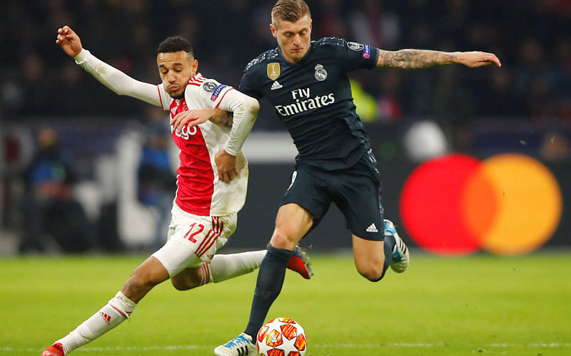 Real Madrid’s Toni Kroos in action with Ajax’s Noussair Mazraoui in the Champions League Round of 16 First Leg against Ajax Amsterdam at Johan Cruijff Arena, Amsterdam, Netherlands on 13 February 2019. Photo: Reuters