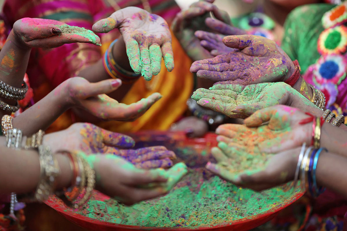 Women take preparation moments before the festival of abeer (coloured powders) at the fine arts faculty of Dhaka University to celebrate the arrival of spring on 13 February. Photo: Saiful Islam