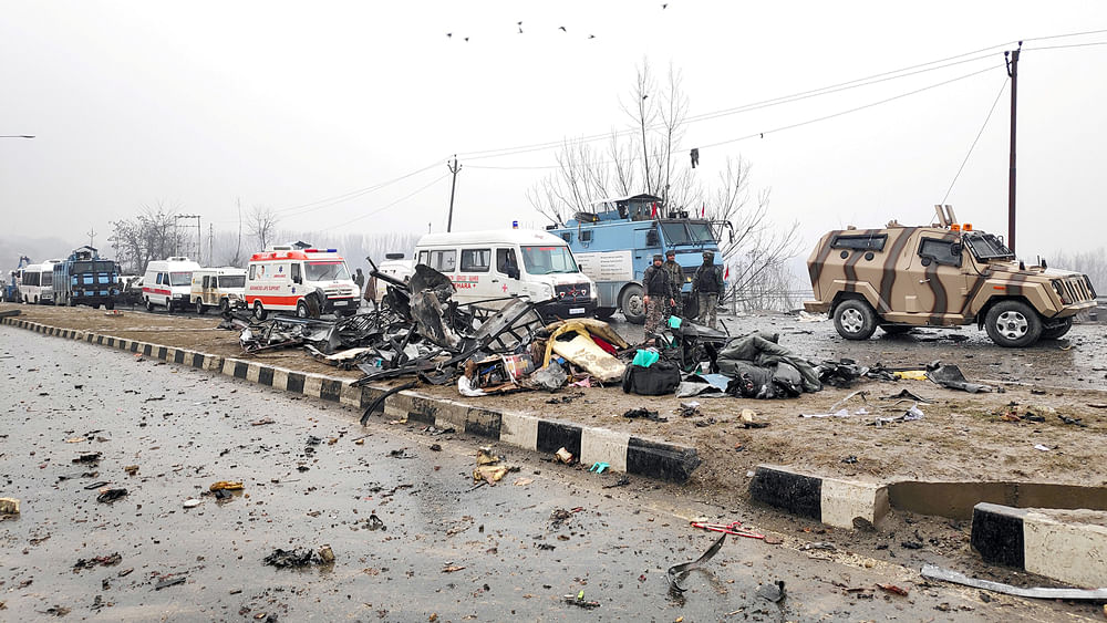 Indian soldiers examine the debris after an explosion in Lethpora in south Kashmir`s Pulwama district. Photo: Reuters