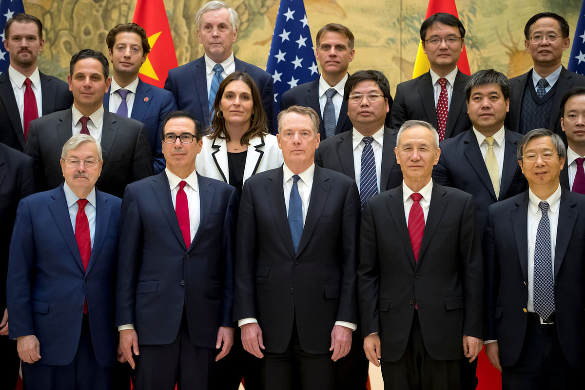 Front row from left, US Ambassador to China Terry Branstad, US Treasury Secretary Steven Mnuchin, US Trade Representative Robert Lighthizer, Chinese Vice Premier Liu He, and People`s Bank of China Governor Yi Gang pose for a group photo at the Diaoyutai State Guesthouse in Beijing, China on 15 February 2019. Photo: Reuters