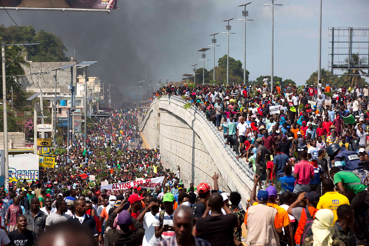 Thousands of demonstrators march in the street as they chant anti-government slogans during a protest to demand the resignation of president Jovenel Moise and demanding to know how Petro Caribe funds have been used by the current and past administrations, in Port-au-Prince, Haiti, Thursday, 7 February 2019. Photo: AP