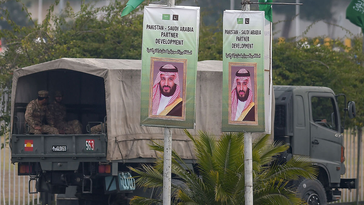 Pakistani soldiers patrol on a street next to welcoming posters of Saudi Arabian crown prince Mohammed bin Salman in Islamabad on 17 February, 2019. Photo: AFP