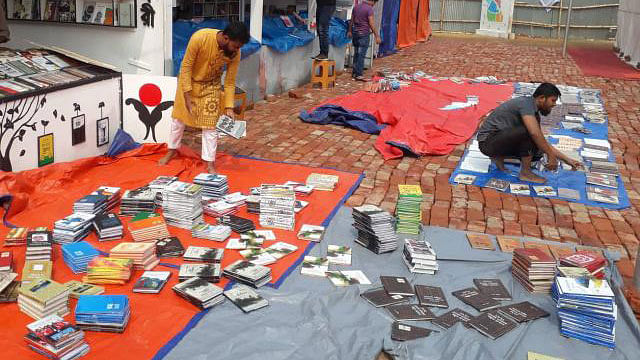 A number of books at Amar Ekushey Book Fair get drenched in rain on Sunday morning. Photo: Sajid Hossain