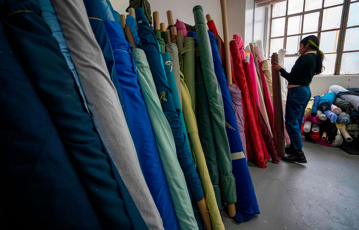 Customers choose fabrics to buy at Fabscrap on 1 February 2019 at the company`s warehouse in New York. Photo: AFP