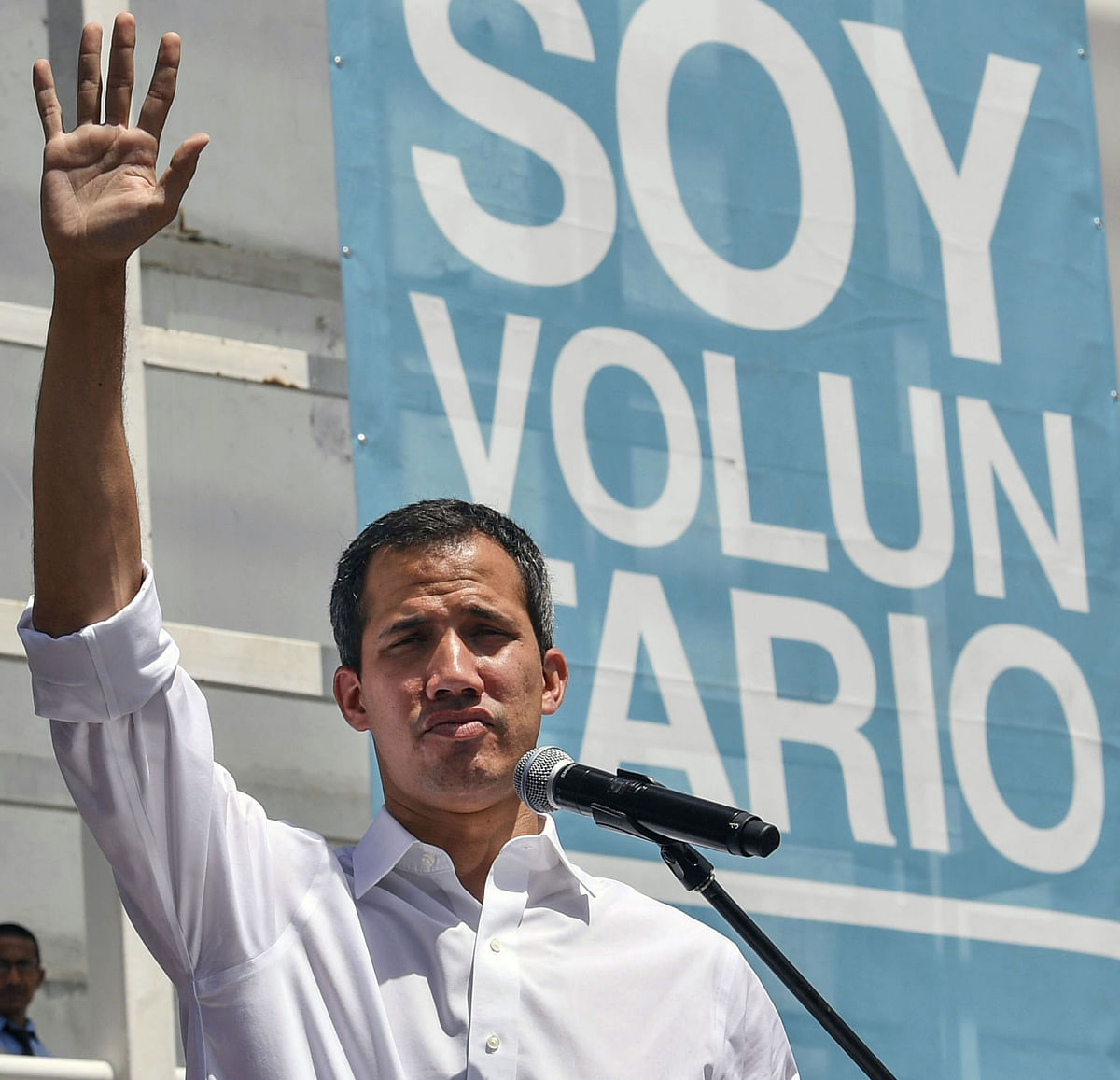Venezuelan opposition leader and self declared acting president Juan Guaido gestures as he waves during a rally with volunteers of the movement `Help and Freedom Venezuela Coalition` in Caracas, on 16 February. Photo: AFP