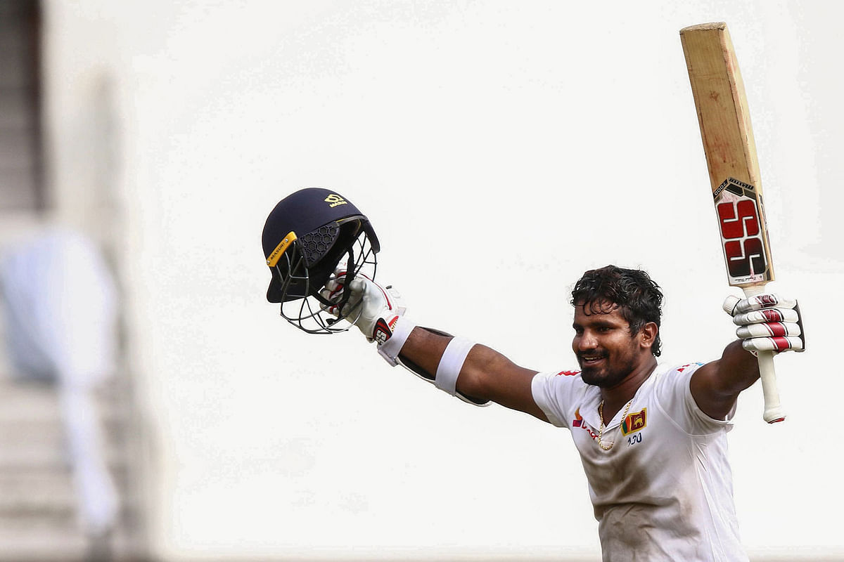 Sri Lanka`s Kusal Perera celebrates the victory after hitting the winning runs of a South Africa`s player during the fourth day of the first Cricket Test between South Africa and Sri Lanka at the Kingsmead Stadium in Durban on 16 February 2019. Photo: AFP