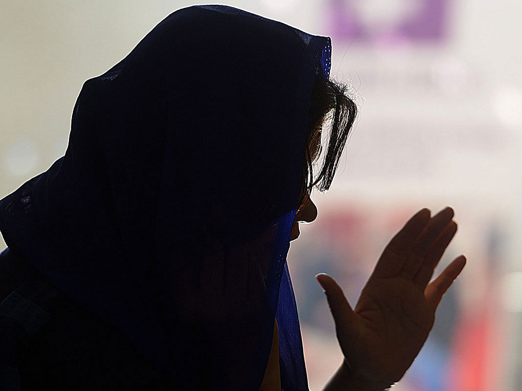 In this picture taken on 17 December 2018, Ayeesha, an employee of the Pakistani NGO Aware Girls, speaks during a call on the hotline `Sahailee` (`friend` in Urdu) dedicated to abortion in Peshawar. Photo: AFP