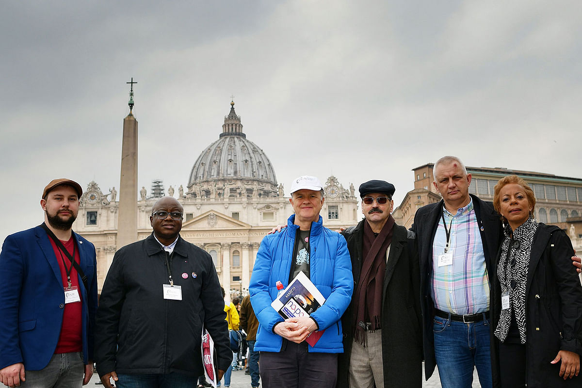 (From L) Victims of sexual abuse Maniuse Mileiosky, Benjamin Kitobo, Peter Saunders, Jacques, Marek Lisinski and Denise Buchanan pose in front Saint Peter`s square on 18 February 2019, in Rome. Photo: AFP