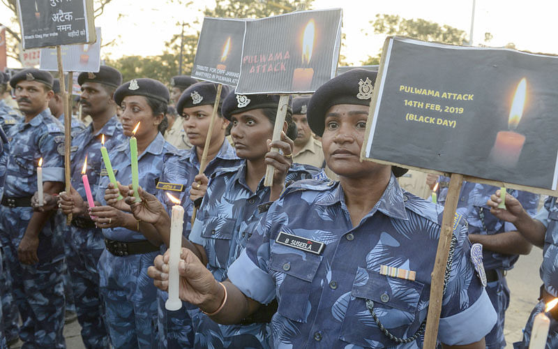 Indian Central Reserve Police Force (CRPF) personnel hold candles and pay tribute to their colleagues in Hyderabad on 15 February  the day after an attack on a paramilitary Central Reserve Police Force (CRPF) convoy in the Lethpora area of Kashmir. Photo: AFP