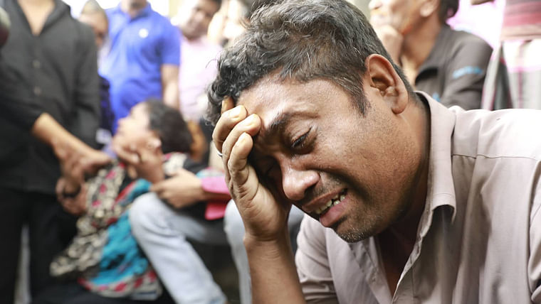 A man cries after the deadly fire in Old Dhaka. Photo: Prothom Alo