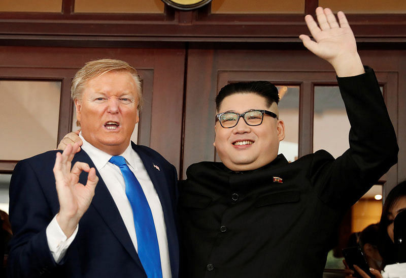 Howard X, an Australian-Chinese impersonator of North Korean leader Kim Jong Un and Dennis Alan, who is impersonating US president Donald Trump, pose for a photo at Metropole Hotel, ahead of the upcoming Trump-Kim summit in Hanoi. Photo: Reuters