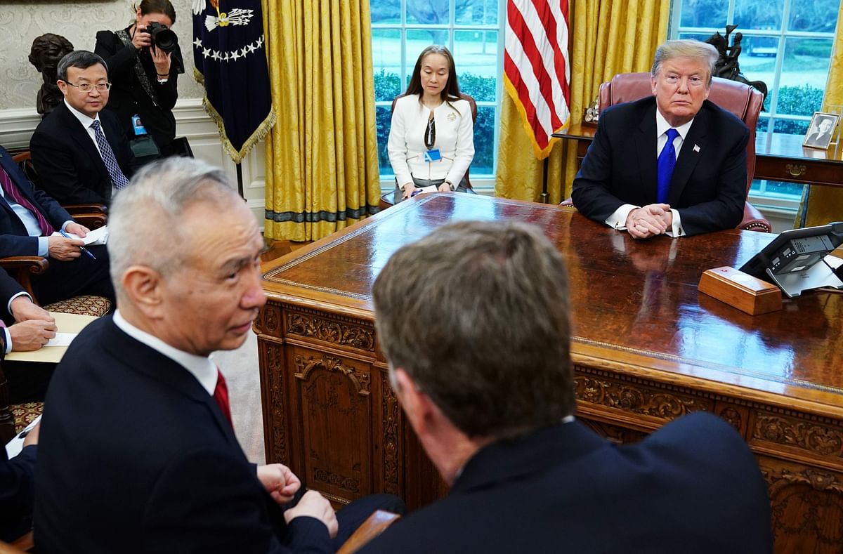 US president Donald Trump watches as China`s vice premier Liu He (L) speaks with US trade representative Robert Lighthizer (R) in the Oval Office of the White House in Washington, DC on 22 February 2019. Photo: AFP
