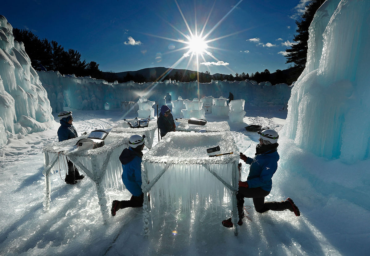 In this 26 January 2019 photo, icicles are harvested for use in growing the walls at Ice Castles in North Woodstock, N.H. The winter wonderland is one of six in North America. Photo: AP