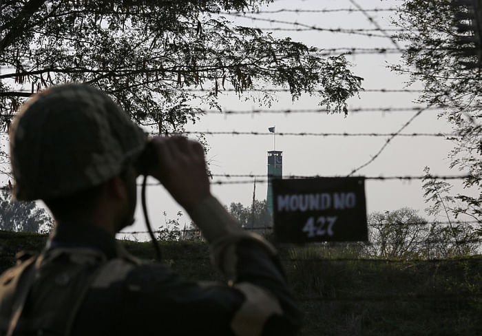 India's Border Security Force soldier keeps vigil during patrol