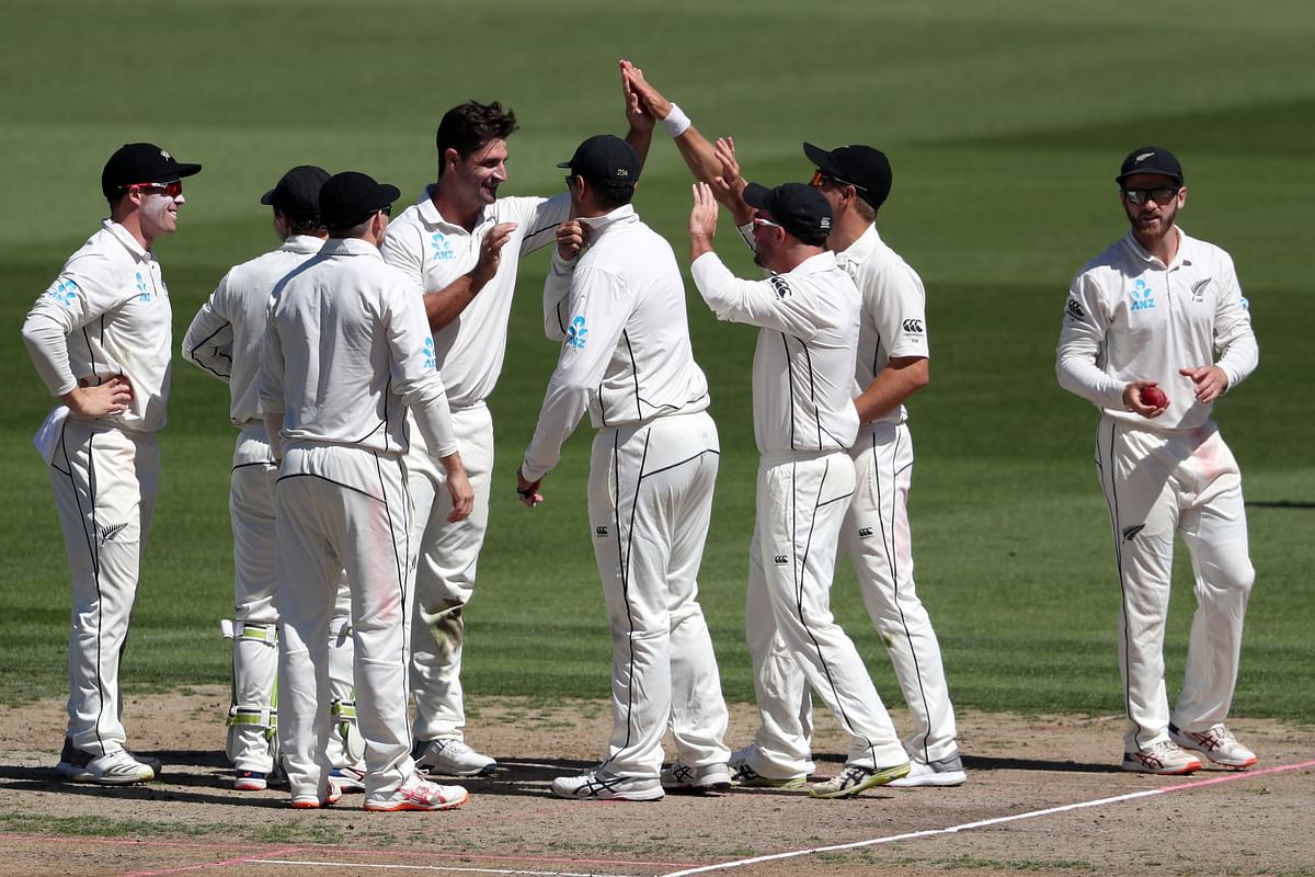 New Zealand`s Colin de Grandhomme (C) celebrates the wicket of Bangladesh`s Tamim Iqbal during day one of the first cricket Test match between New Zealand and Bangladesh at Seddon Park in Hamilton on 28 February 2019. Photo: AFP