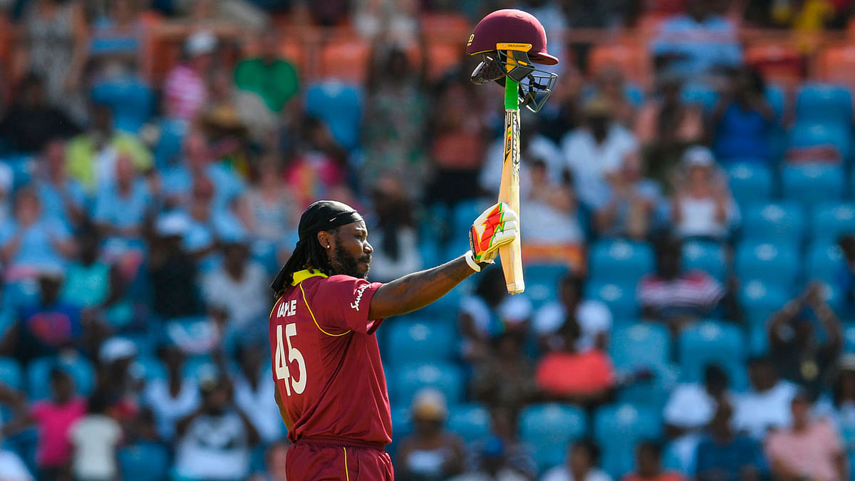 Chris Gayle of West Indies celebrates achieving 10,000 ODI runs during the 4th ODI between West Indies and England at Grenada National Cricket Stadium, Saint George`s, Grenada, on 27 February 2019. Photo: AFP