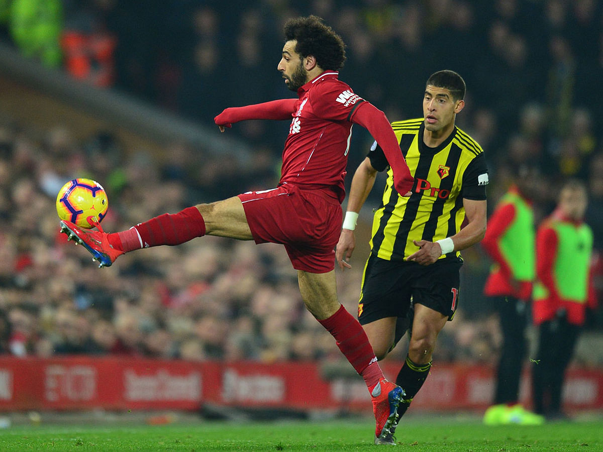 Liverpool`s Egyptian midfielder Mohamed Salah controls the ball during the English Premier League football match between Liverpool and Watford at Anfield in Liverpool, north west England on 27 February 2019. Photo: AFP